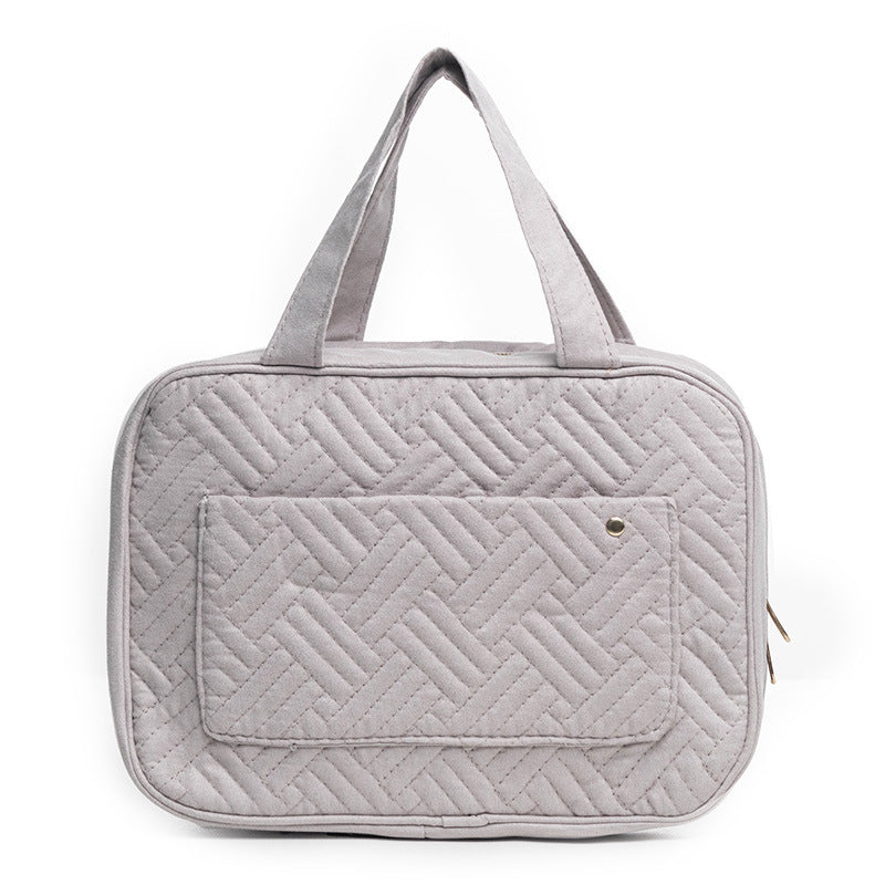 gray quilted cosmetic bag with lightweight travel design