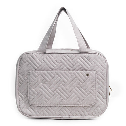 gray quilted cosmetic bag with lightweight travel design