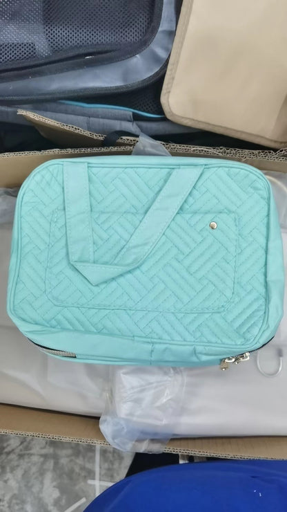 green quilted cosmetic bag with spacious storage design